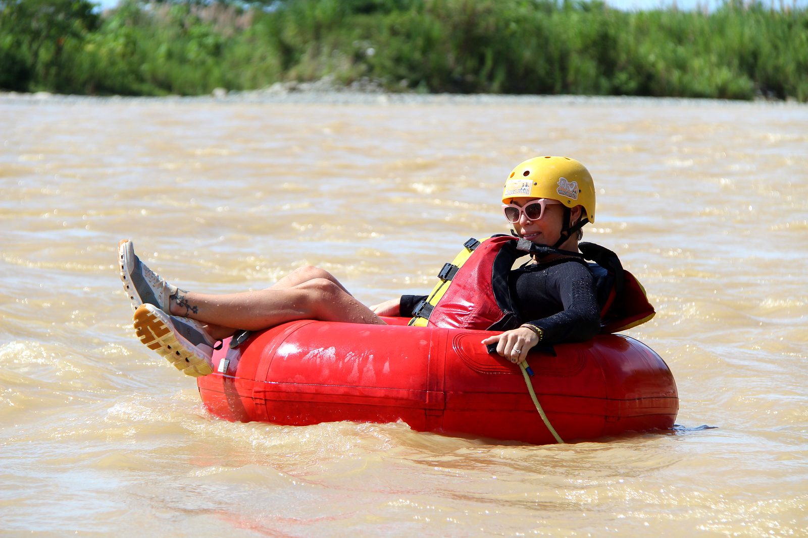 A guest puts her feet up in her tube