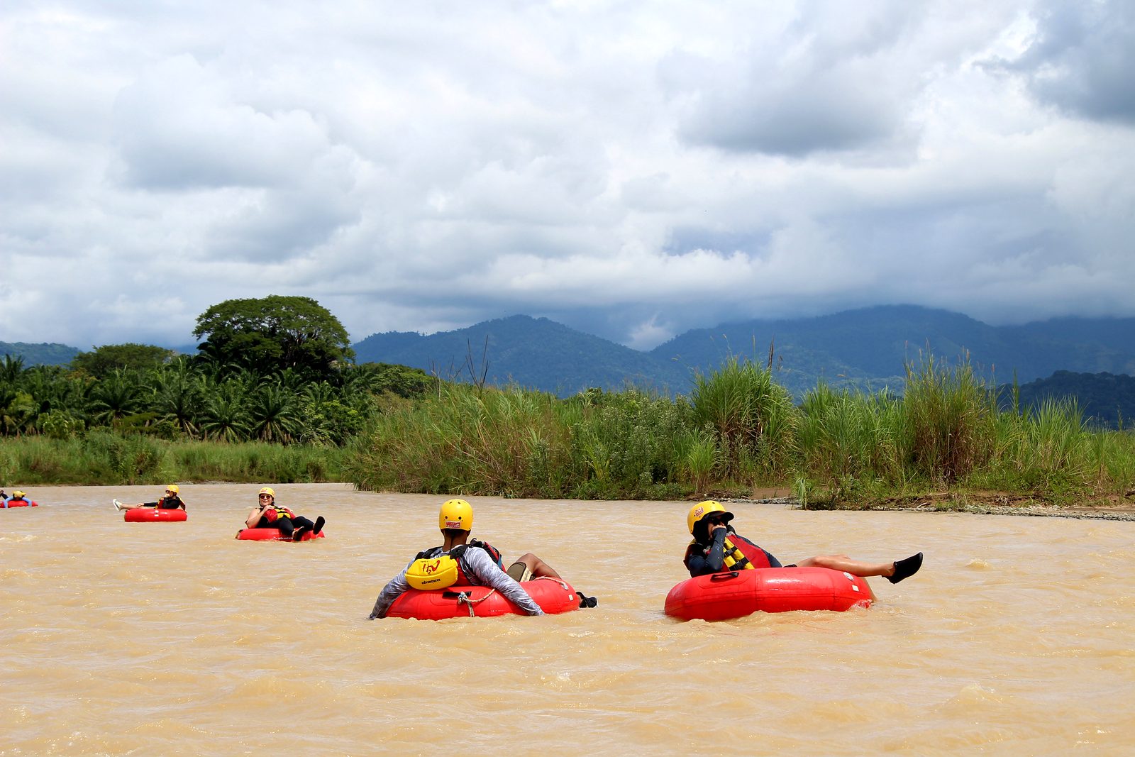 A line of guests floats down the Naranjo toward the mountains